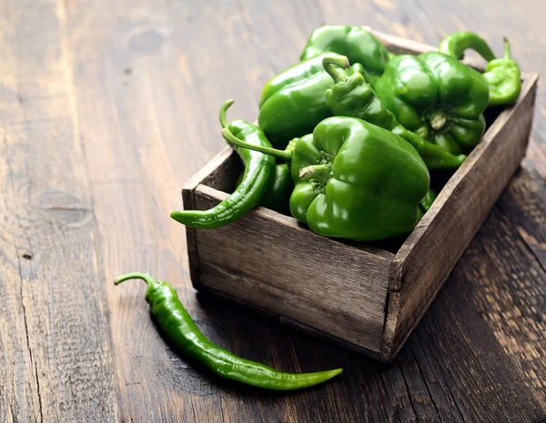 Green bell peppers in a box