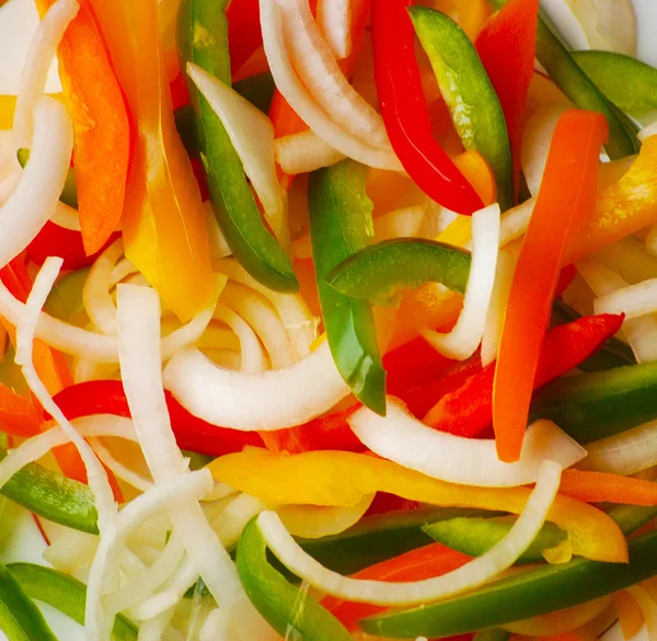 Sliced Green Peppers, Orange Peppers, Red Pepper, Yellow Peppers and Onions