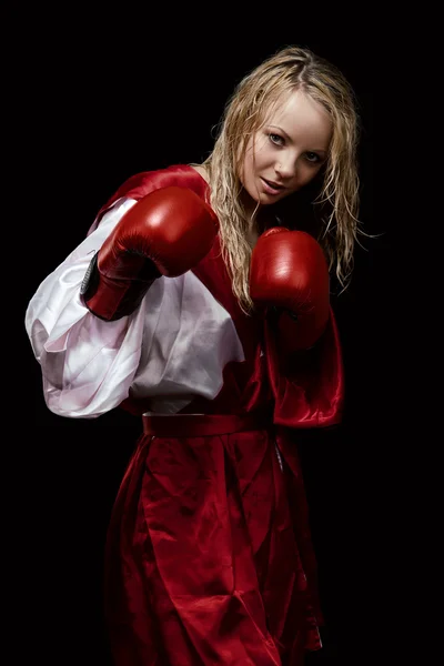 Woman in red silk bathrobe and gloves