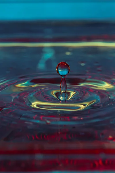 Beautiful colorful water splash from fallen drop