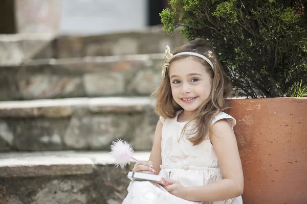 Little writer with her notebook and pencil