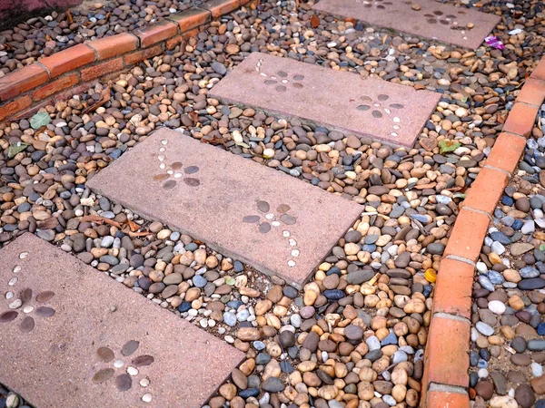 Stone walkway and bricks in garden