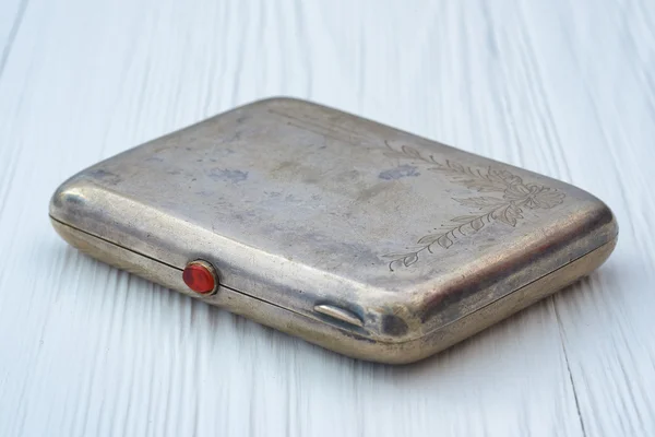 Vintage metal cigarette case with an engraving on the lid