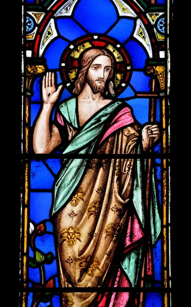 View of an old stained glass depiction of Jesus on a window