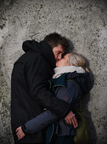 A couple embrace as pagans and druids celebrate the winter solstice