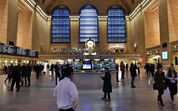 Rail travelers pass through Grand Central Station