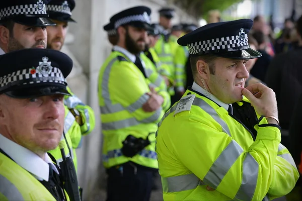 Police deploy during a rally against government public sector