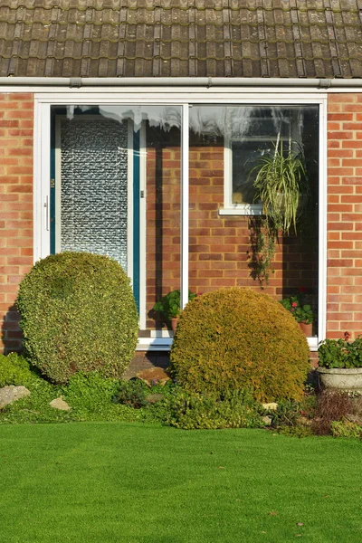 Front Door and Porch of a Red Brick House