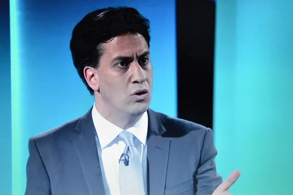 A viewer watches opposition party Labour leader Ed Miliband on an election TV debate