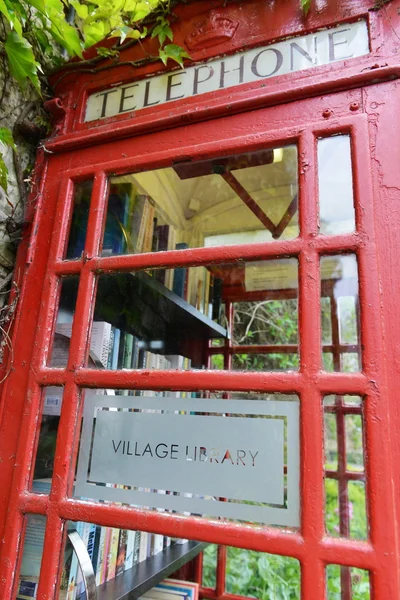 View of a village library in a disused phone box
