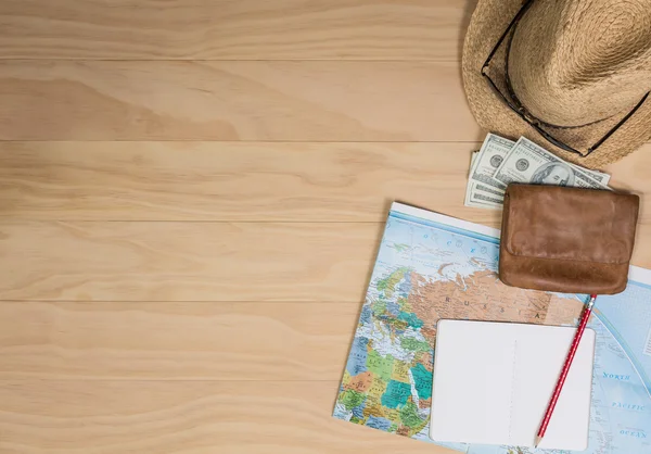Travel items on wooden table
