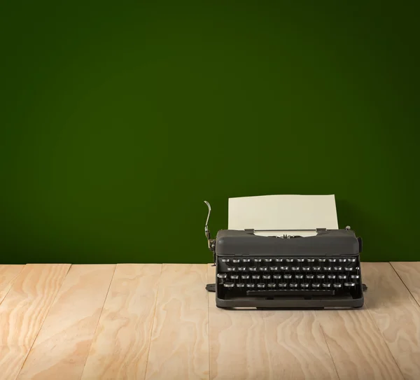 Image of vintage typewriter on blackboard wallpaper
