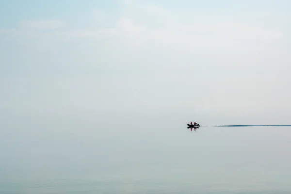 Boat sailing on Lake Baikal in the fog