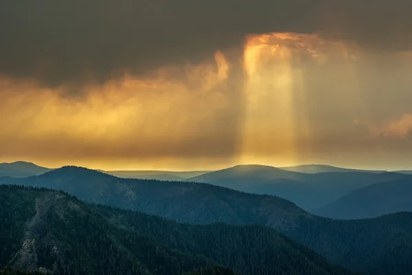 Pillar of light illuminates the hills of Khamar-Daban