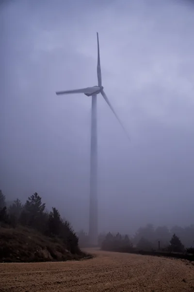 Wind turbine between fog