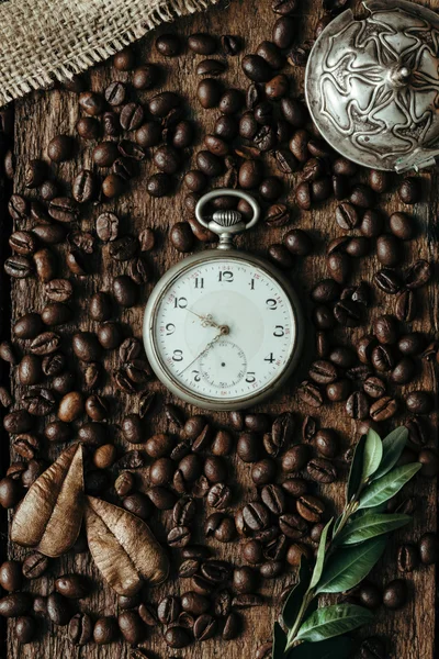 Coffee beans on wooden background. Flat lay