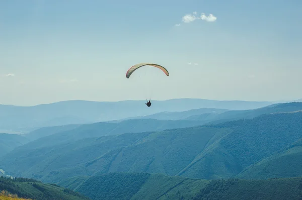 Paraglider, paragliding in the mountains, adrenalin sports