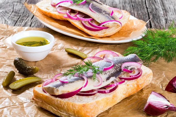 Herring fillets with onion and lime slice, close-up