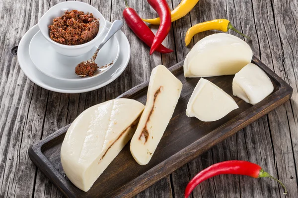 Homemade mozzarella with adjika or red pesto, top view