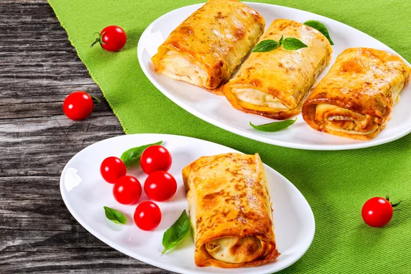Rolled pancakes or crepes stuffed with minced meat and vegetable