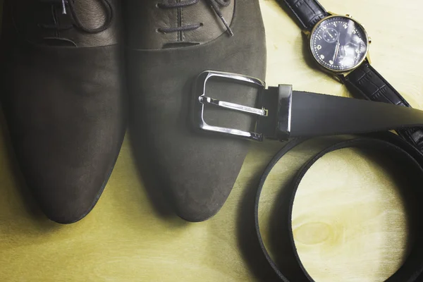 Men\'s fashion accessory wrist chyasi belt on wooden background
