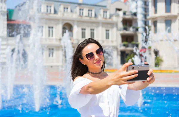 Young happy woman make selfie