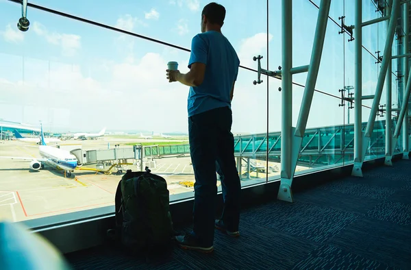 Passenger with coffee cup