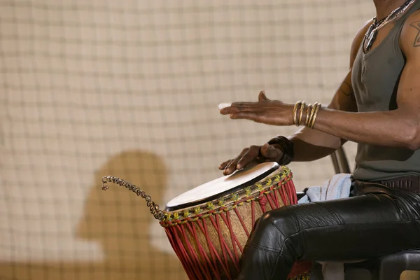 African man playing drum