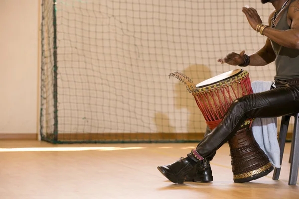 African man playing drum