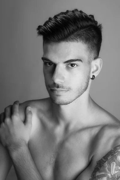 Black and white portrait photo of a young man model