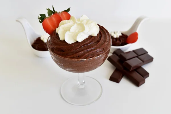 Glass of Chocolate pudding with whipped cream and strawberry