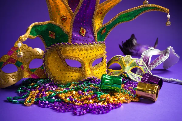 Assorted Mardi Gras or Carnivale mask on a purple background