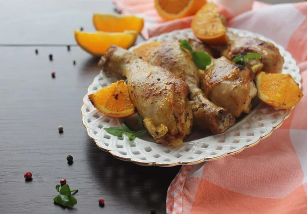 Roasted chicken legs in cast iron skillet, selective focus