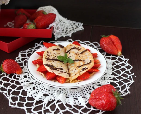 Protein Pancakes with strawberries for breakfast on plate