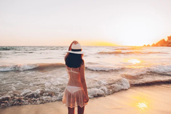 Woman walks along beautiful seashore