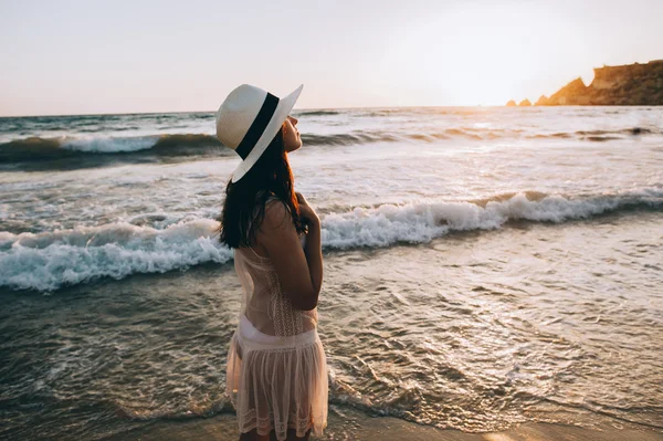 Woman walks along beautiful seashore