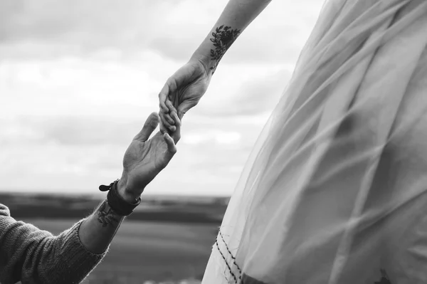 Hands with identical tattoos