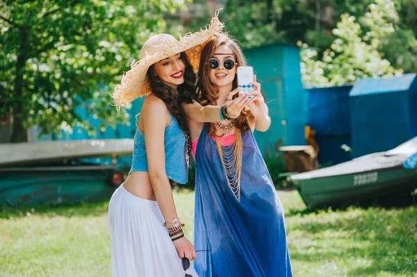 Two beautiful girls making slefie