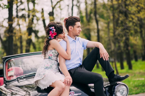 Young couple in vintage car