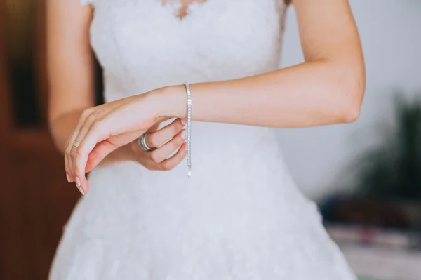 Jeweler bracelet on the bride's hand