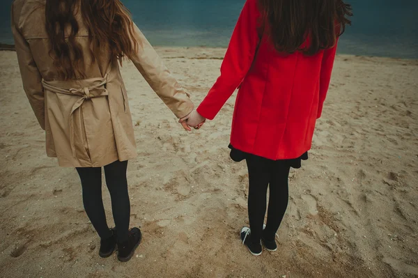 Girls holding hands