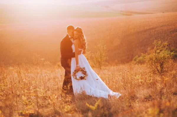 Beautiful newlyweds in mountains