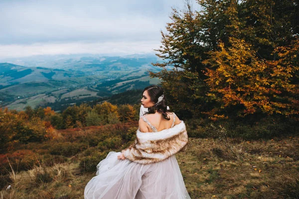 Beautiful bride in mountains