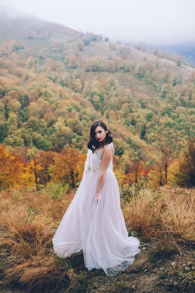 Beautiful bride in mountains