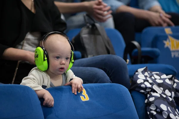 Young fan watching a basketball game