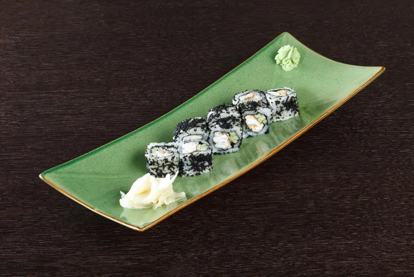 Sushi rolls on a plate with flying fish roe
