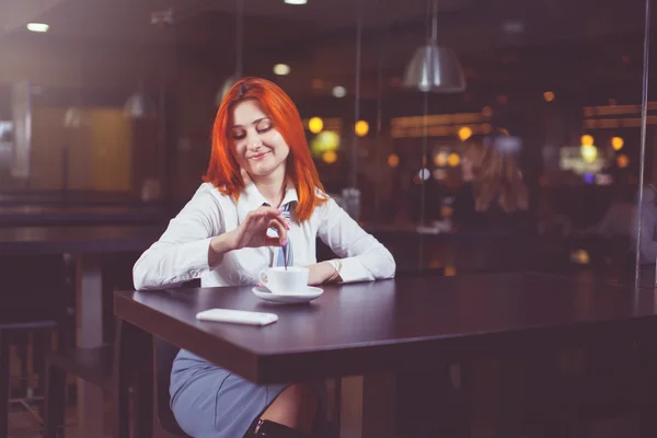 Portrait of a young beautiful businesswomen  while sitting in cafe bar interior during morning breakfast