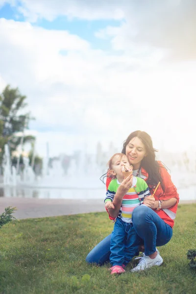 Emotional mother and daughter with ice cream on a background of