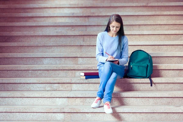 Students Walking Outdoors On University Campus