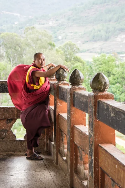 Buddhist monk standing in monastery